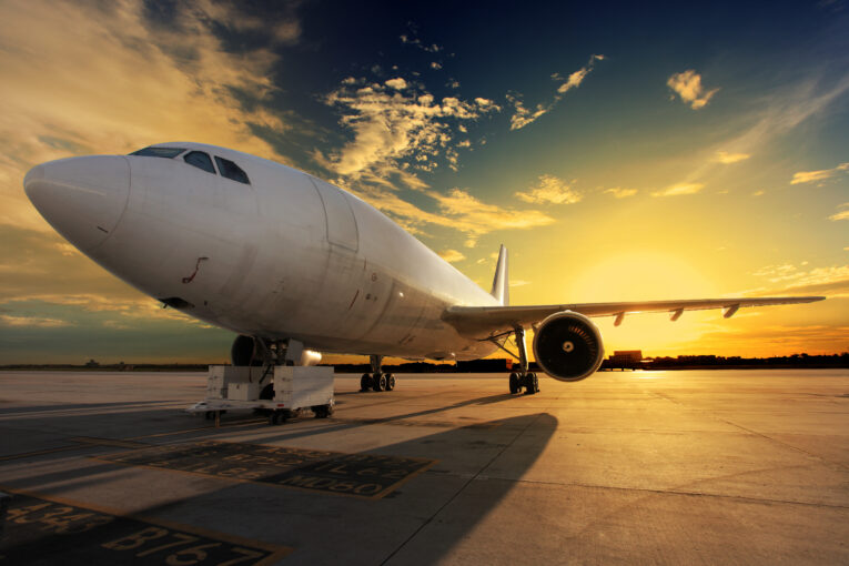 Airplane at sunset - back lit